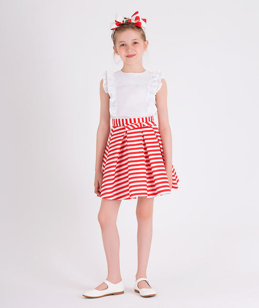 casual summer outfit with an ecru ruffled blouse and a skirt with red and white stripes