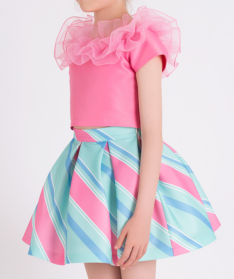 pink blouse with ruffled neckline, mint and blue striped skirt