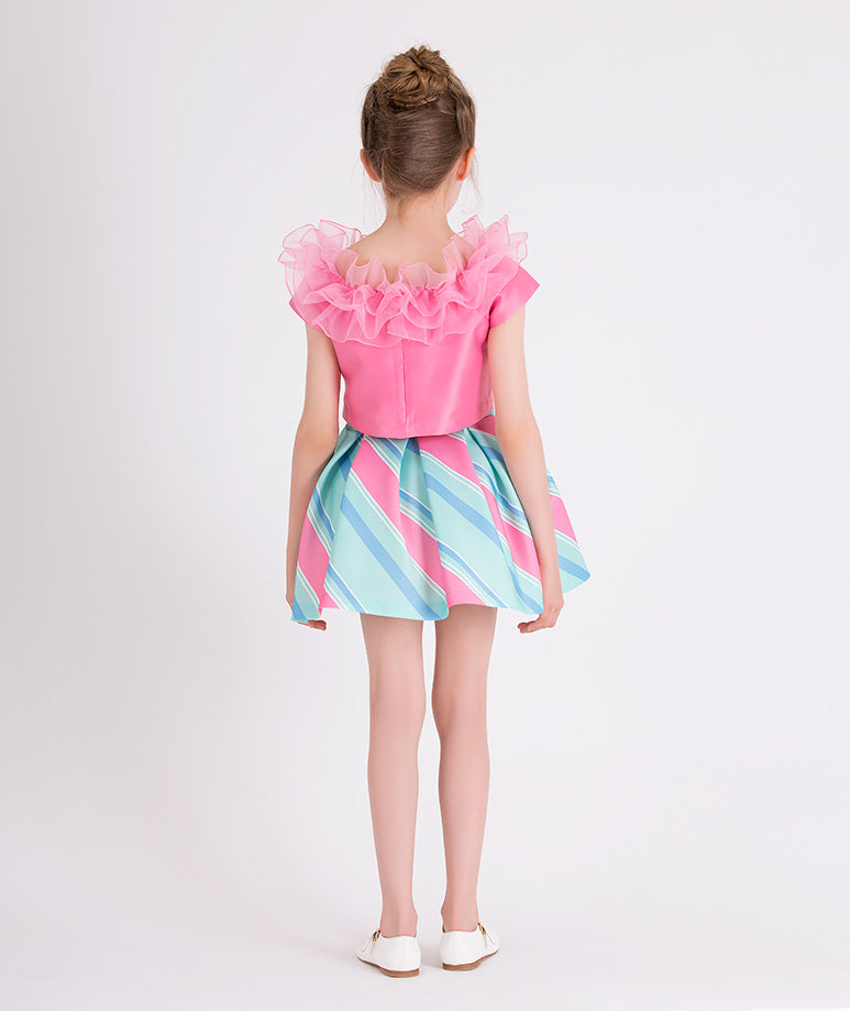 pink ruffled blouse and pink and blue striped skirt