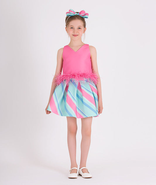 pink sleeveless blouse with feathery waist, pink and blue striped skirt