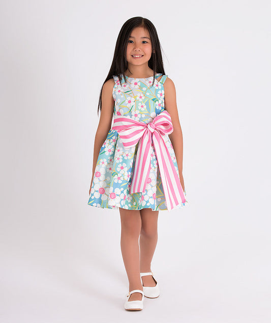 blue floral summer dress with a big, pink and white striped bow on the waist