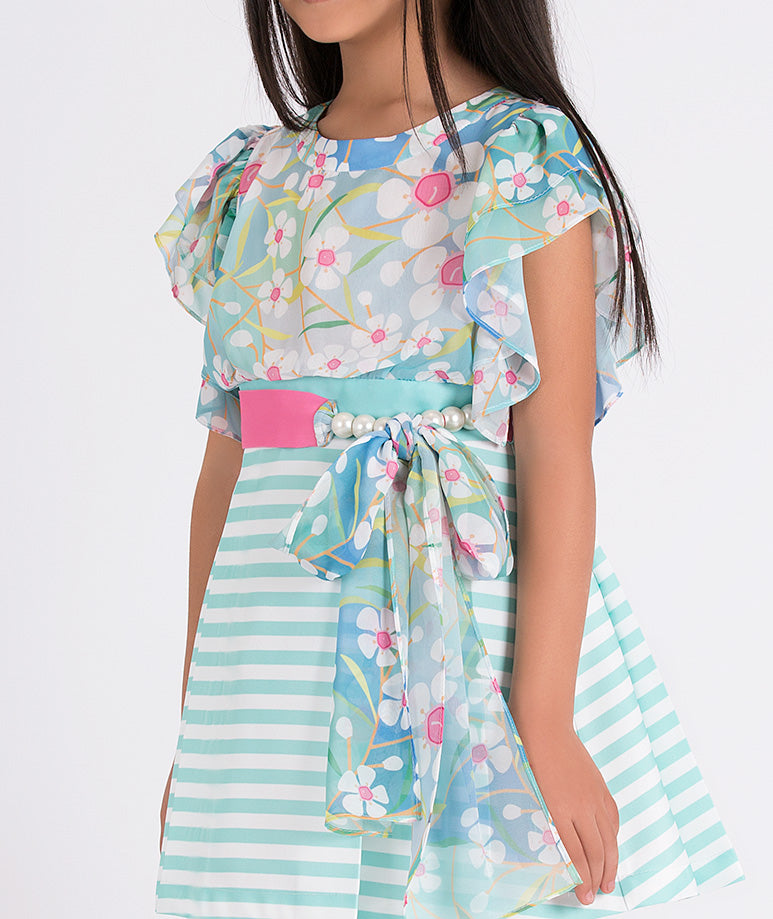 floral dress with pink belt and blue striped skirt